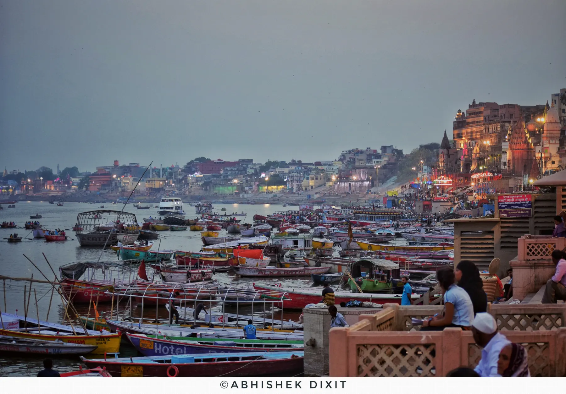 Boats crowding the river at Dashashwamedh at dusk